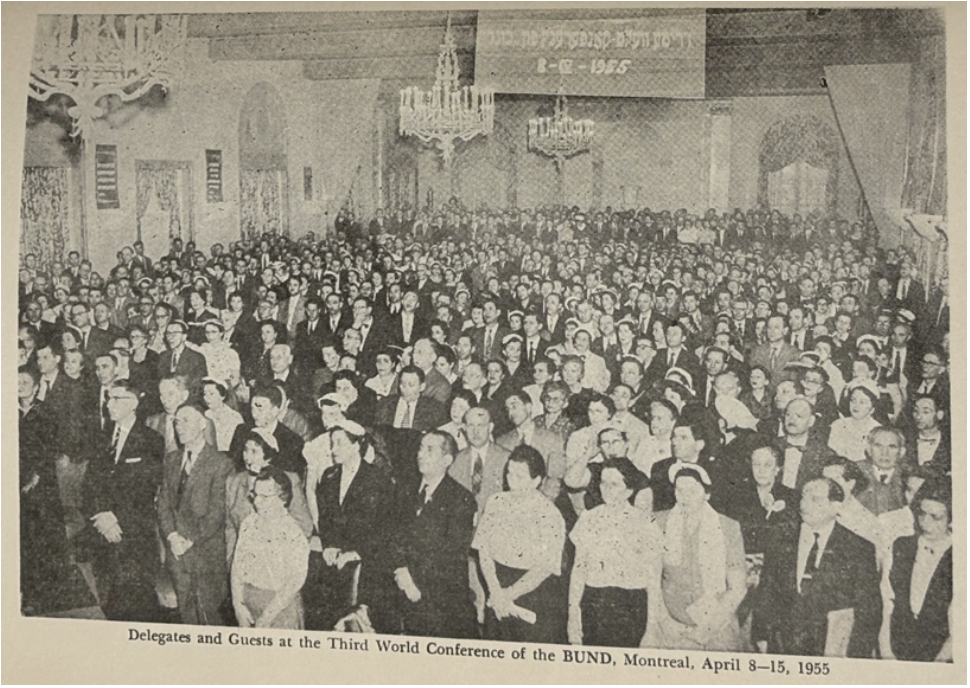 A sepia tone photo of a large crowd in a ballroom, with the caption reading Delegates and Guests at the 3rd world conference of the BUND, montreal, apreil8-15, 1955